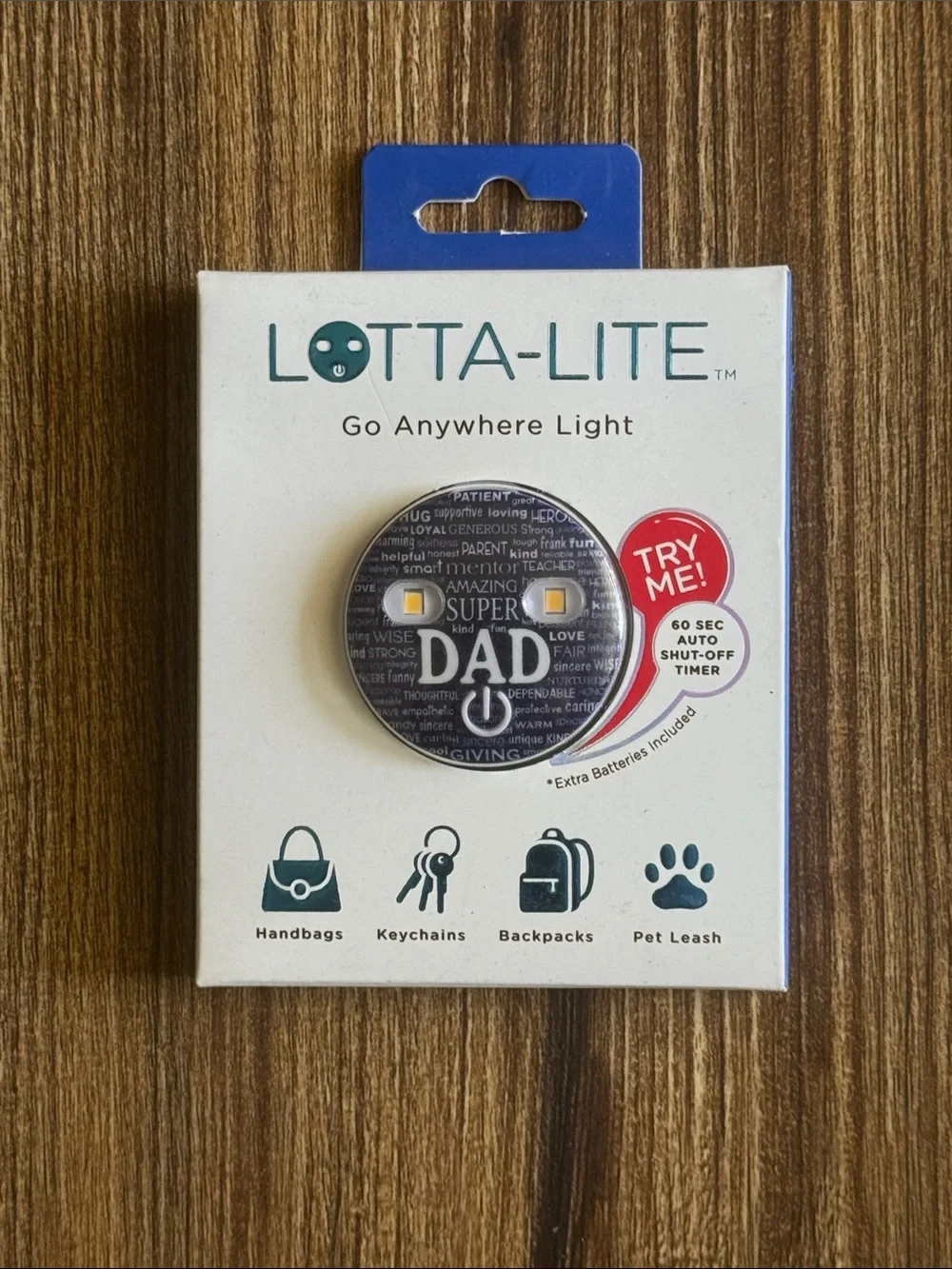 The Dad Lotta-Lite navy blue graphic-print LED clip-on light.